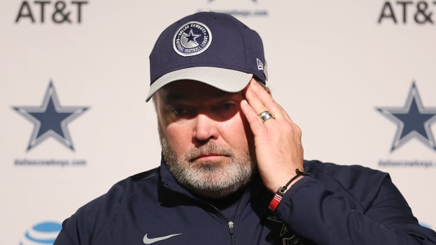 Cowboys coach Mike McCarthy talking to reporters during a press conference.